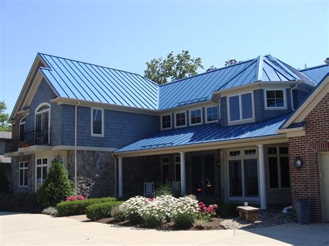 house blue metal roof|gray house with blue roof.